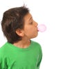 Boy blowing a pink bubble gum Royalty Free Stock Photo