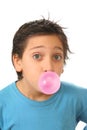 Boy blowing a pink bubble gum Royalty Free Stock Photo