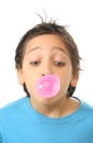 Boy blowing a pink bubble gum Royalty Free Stock Photo