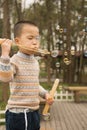 Boy blowing soapbubbles