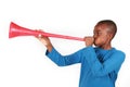 Boy Blowing Vuvuzela Royalty Free Stock Photo