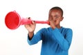 Boy Blowing Vuvuzela Royalty Free Stock Photo