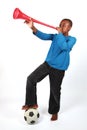 Boy Blowing Vuvuzela Royalty Free Stock Photo