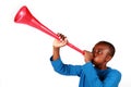 Boy Blowing Vuvuzela Royalty Free Stock Photo