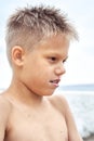 Boy with blue lips frozen from swimming in cold sea water Royalty Free Stock Photo