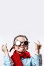 Boy in blue shirt, red scarf, biker glasses and bandana on light background Royalty Free Stock Photo