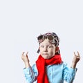 Boy in blue shirt, red scarf, biker glasses and bandana on light background Royalty Free Stock Photo