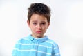 The boy in the blue T-shirt is snable and ready to cry. Red eyes Royalty Free Stock Photo
