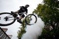 Boy on a bmx/mountain bike jumping