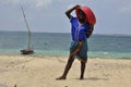 Boy with boat on the island in Mozambique Royalty Free Stock Photo