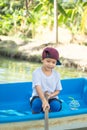 The boy boating in the park. Royalty Free Stock Photo