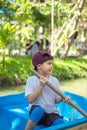 The boy boating in the park. Royalty Free Stock Photo