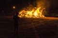 Boy on a bonfire on a beach at night, Costa Brava, Spain Royalty Free Stock Photo