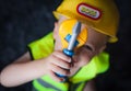 Boy with a Boss builder helmet Royalty Free Stock Photo