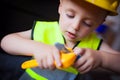 Boy with a Boss builder helmet Royalty Free Stock Photo