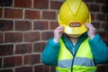 Boy with a Boss builder helmet Royalty Free Stock Photo