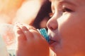 Boy bottle of water. Young boy holding drink fresh water bottle. A child drinks water from a bottle, baby health Royalty Free Stock Photo