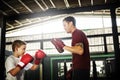 Boy Boxing Training Punch Mitts Exercise Concept