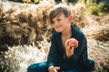 Boy on a breeze in an autumn village. Autumn kids with autumnal mood. Autumn time for kids in farm. Healthy lifestyle Royalty Free Stock Photo