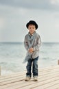 Boy on the bridge at the sea Royalty Free Stock Photo