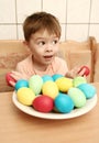 Boy with brightly colored eggs Royalty Free Stock Photo