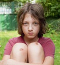 Boy with bruised knee caps. Royalty Free Stock Photo