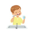 Boy brushing his teeth and rinsing with water, kid caring for teeth in bathroom vector Illustration on a white Royalty Free Stock Photo