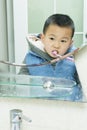 Boy brushing teeth