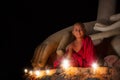 A boy in buddhism set fire with candle in bagan