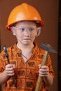 Boy in builder`s clothes