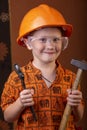 Boy in builder`s clothes