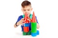 The boy builds a house of cubes Royalty Free Stock Photo