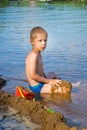 Boy builds a sand