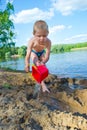 Boy builds a sand