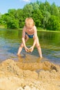 Boy builds a sand