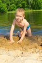 Boy builds a sand