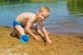 Boy builds a sand