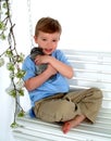 Boy and Bunny on Swing Royalty Free Stock Photo