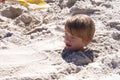 Boy Buried in Sand Royalty Free Stock Photo