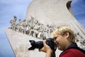 Boy with camera at monument in Portugal. Royalty Free Stock Photo