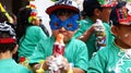 Boy with can of spray foam in carnival parade