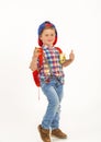 Boy with cap and backpack with fruit in his pockets Royalty Free Stock Photo