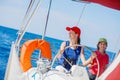 Boy captain with his sister on board of sailing yacht on summer cruise. Travel adventure, yachting with child on family Royalty Free Stock Photo