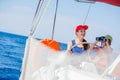 Boy captain with his sister on board of sailing yacht on summer cruise. Travel adventure, yachting with child on family Royalty Free Stock Photo