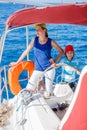 Boy captain with his sister on board of sailing yacht on summer cruise. Travel adventure, yachting with child on family Royalty Free Stock Photo