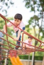 A boy Carefully climb up the rope bridge Royalty Free Stock Photo