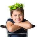 Boy in carnival wearing a crown of shiny green leaves Royalty Free Stock Photo