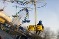 Boy on the carousel in the city park. Royalty Free Stock Photo