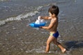 Boy carries a toy-ship Royalty Free Stock Photo