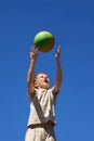 Boy carrom up ball upwards and yell